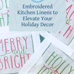 Four cocktail napkins embroidered with different phrases set on evergreens.